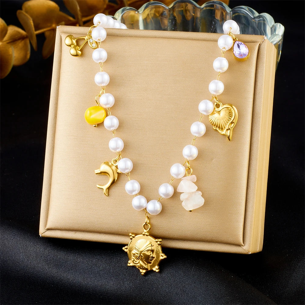 Gold dolphin and pearl bead necklace
