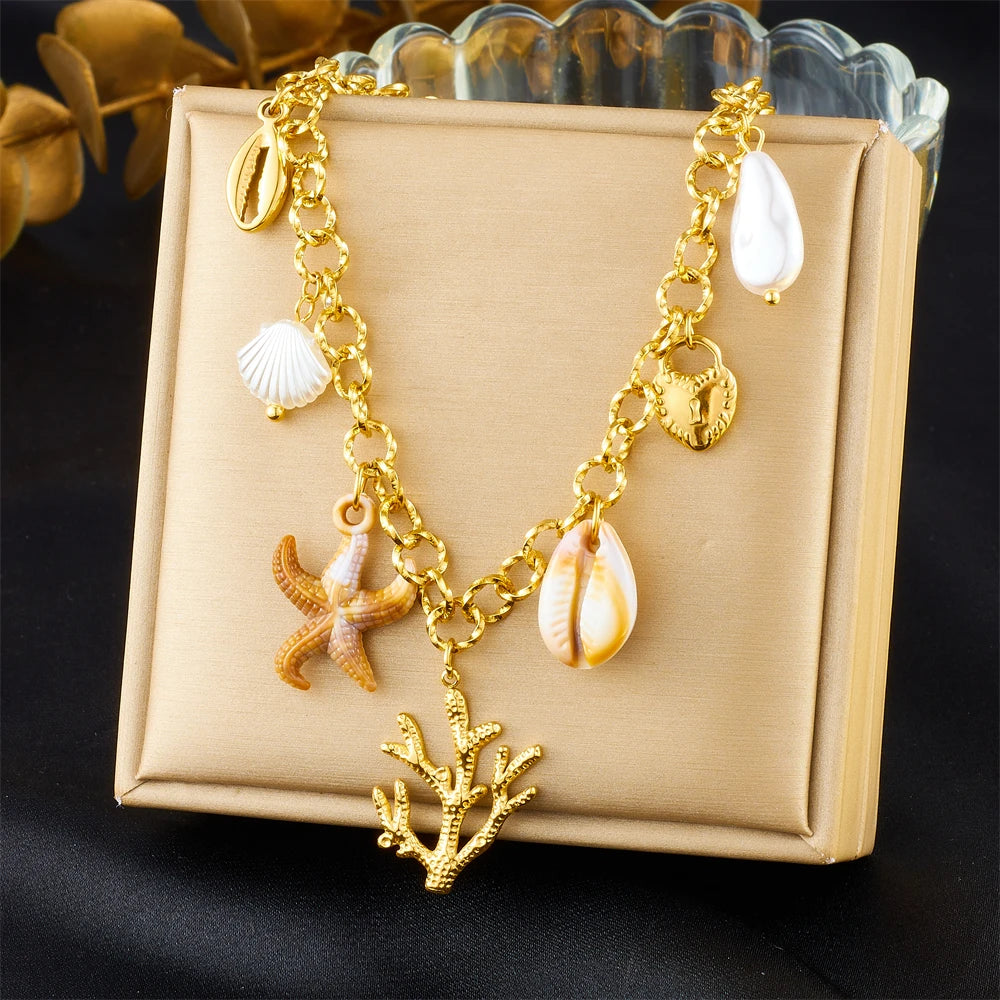 Gold starfish coral and shell charm necklace