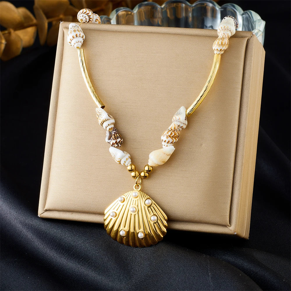 Gold collar necklace with shell beads and scallop pendant